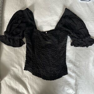 Black woven blouse with a square neck